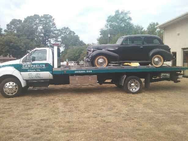 Antique car on flatbed truck