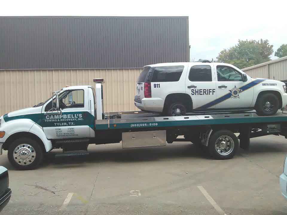 Sheriff's vehicle on tow truck