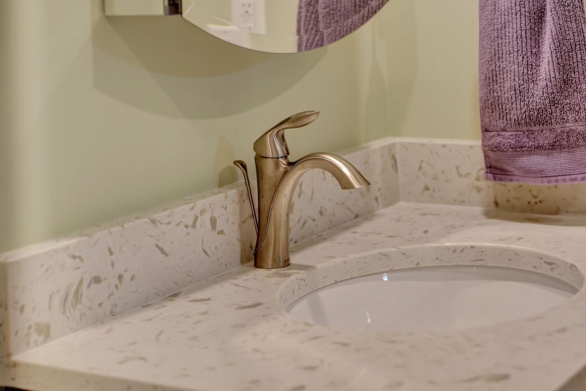 A Bathroom Sink with a Faucet and a Mirror | Lincoln, NE | SkyLimit Remodeling