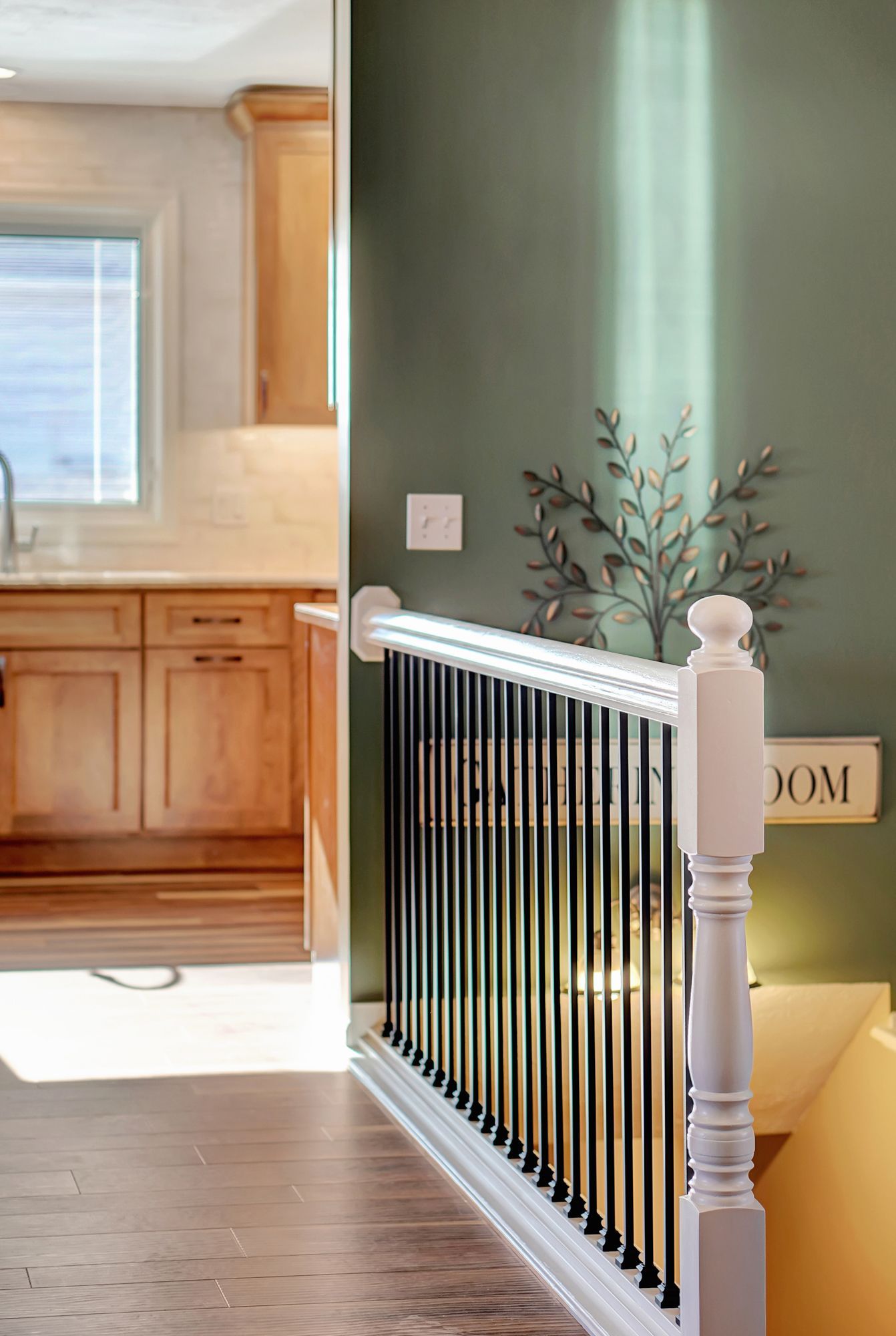 Staircase Railing With A Sign On The Wall - Lincoln, NE - SkyLimit Remodeling