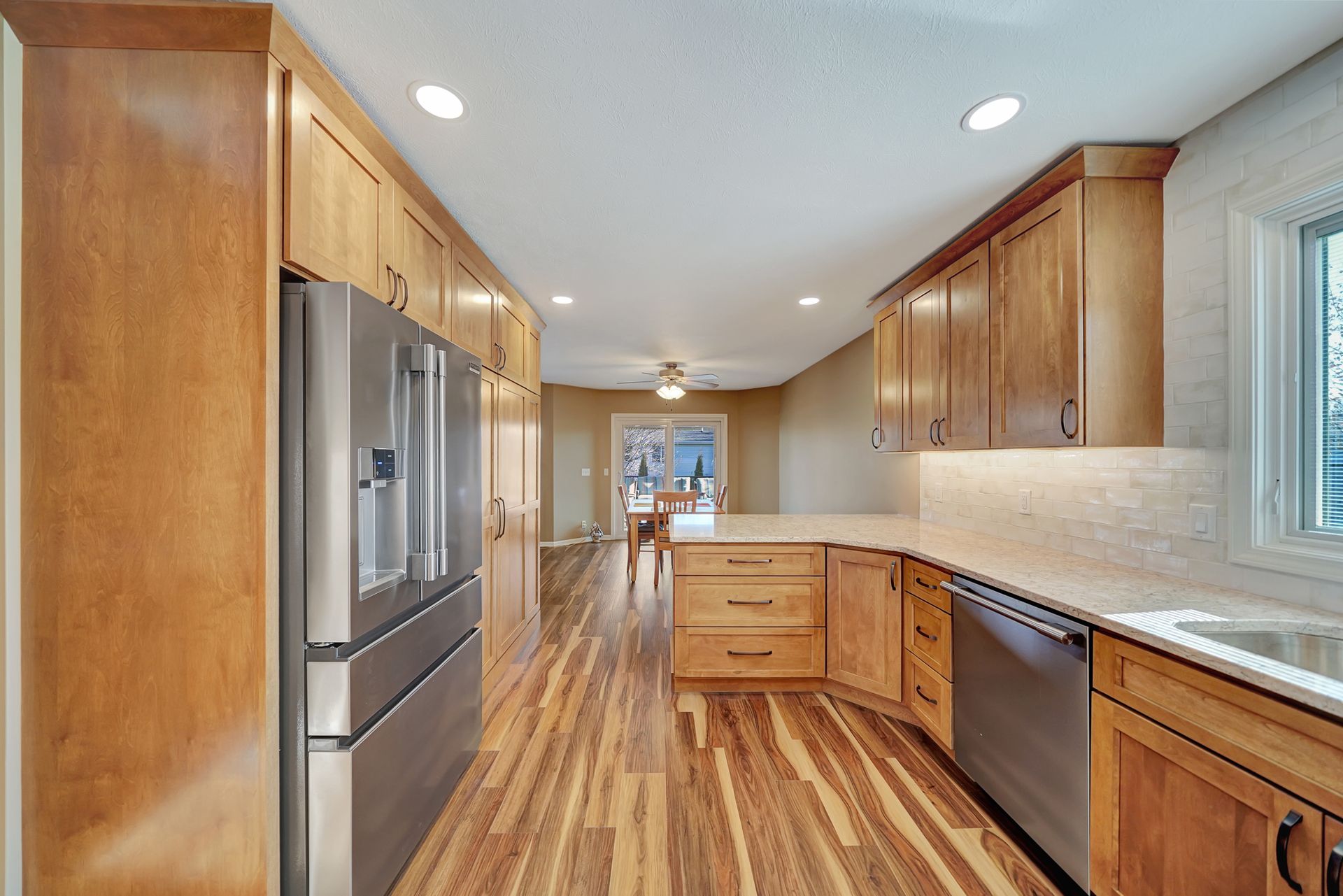 A Kitchen With Cabinets And Appliances - Lincoln, NE - SkyLimit Remodeling