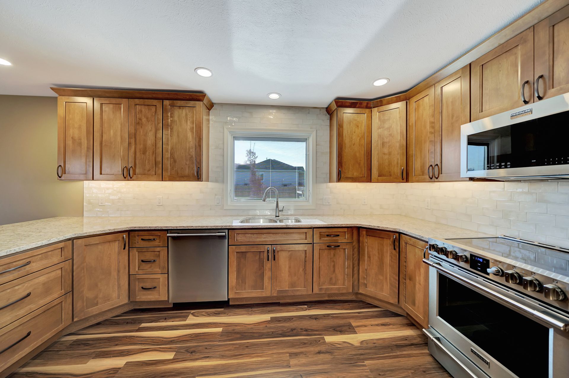 A Kitchen With Wooden Cabinets - Lincoln, NE - SkyLimit Remodeling