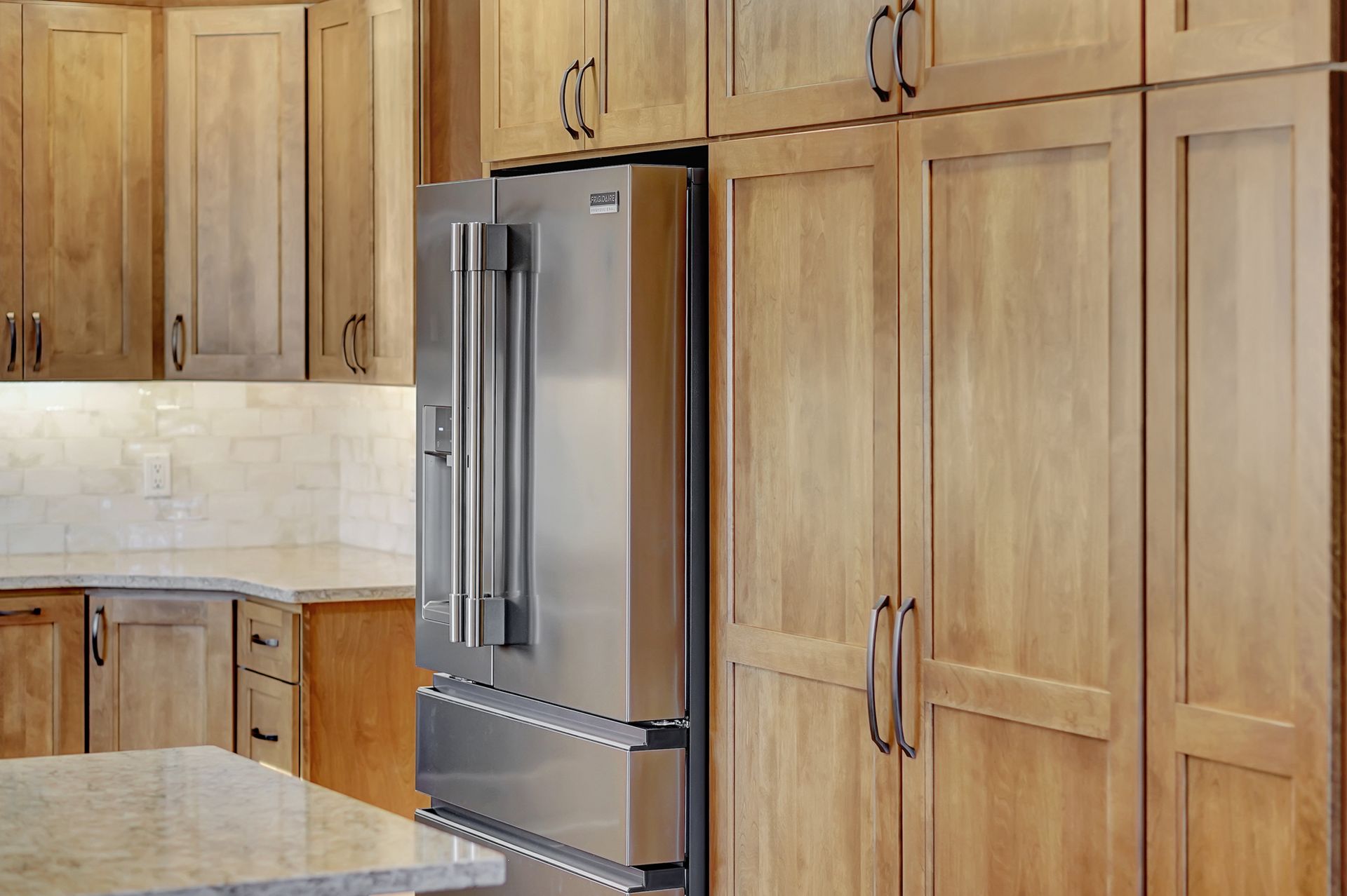 A Stainless Steel Refrigerator In A Kitchen - Lincoln, NE - SkyLimit Remodeling