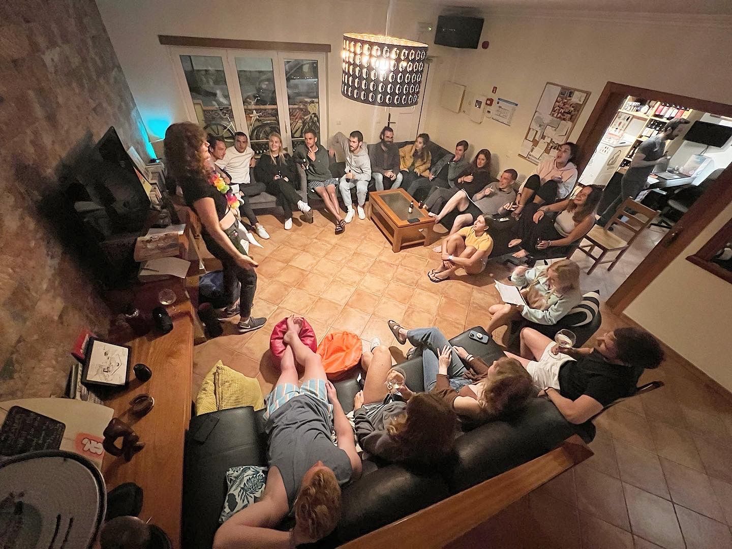 A group of people are sitting on a couch in a living room.