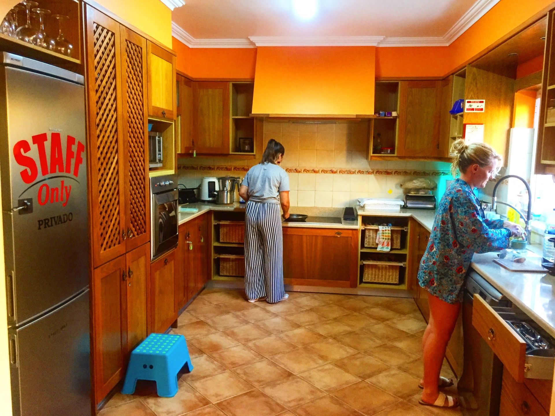 A kitchen with a sign that says staff only