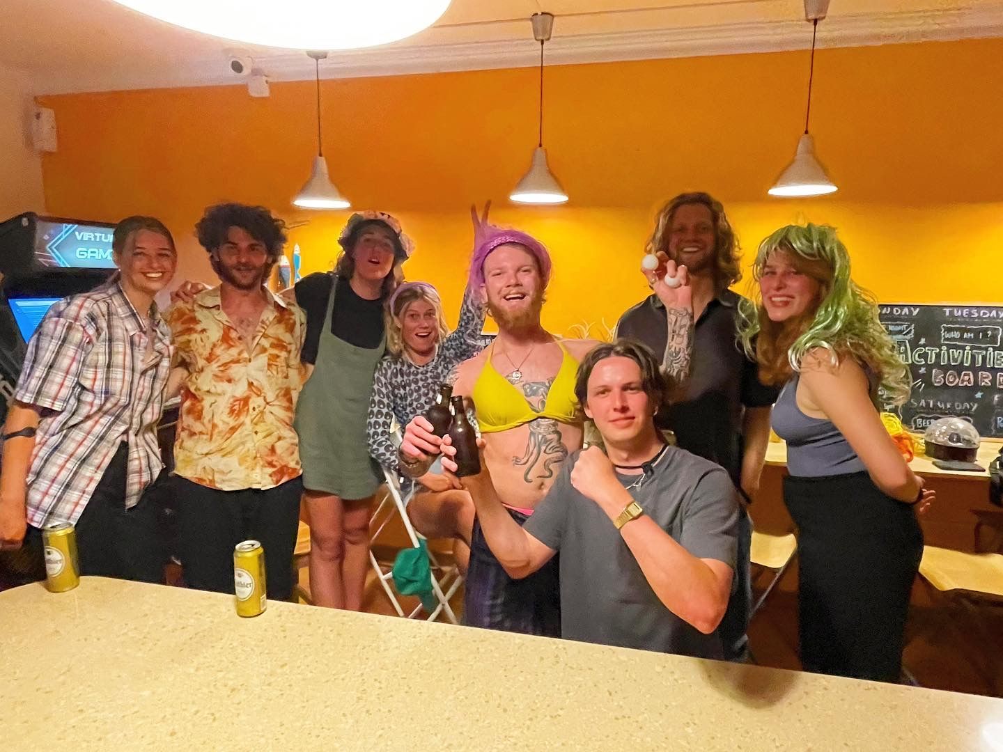 A group of people posing for a picture in a room