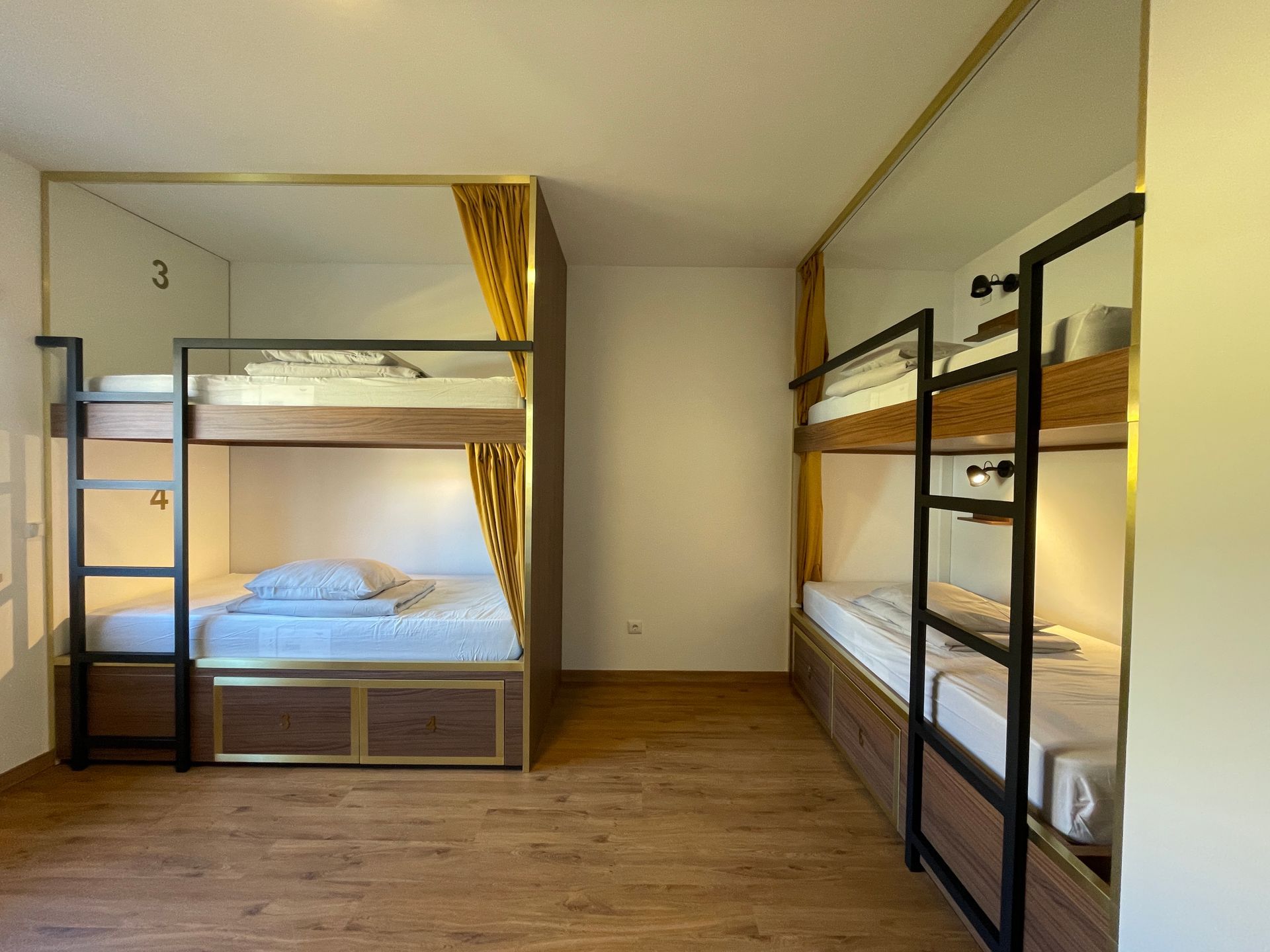 A room with bunk beds and a ladder in it