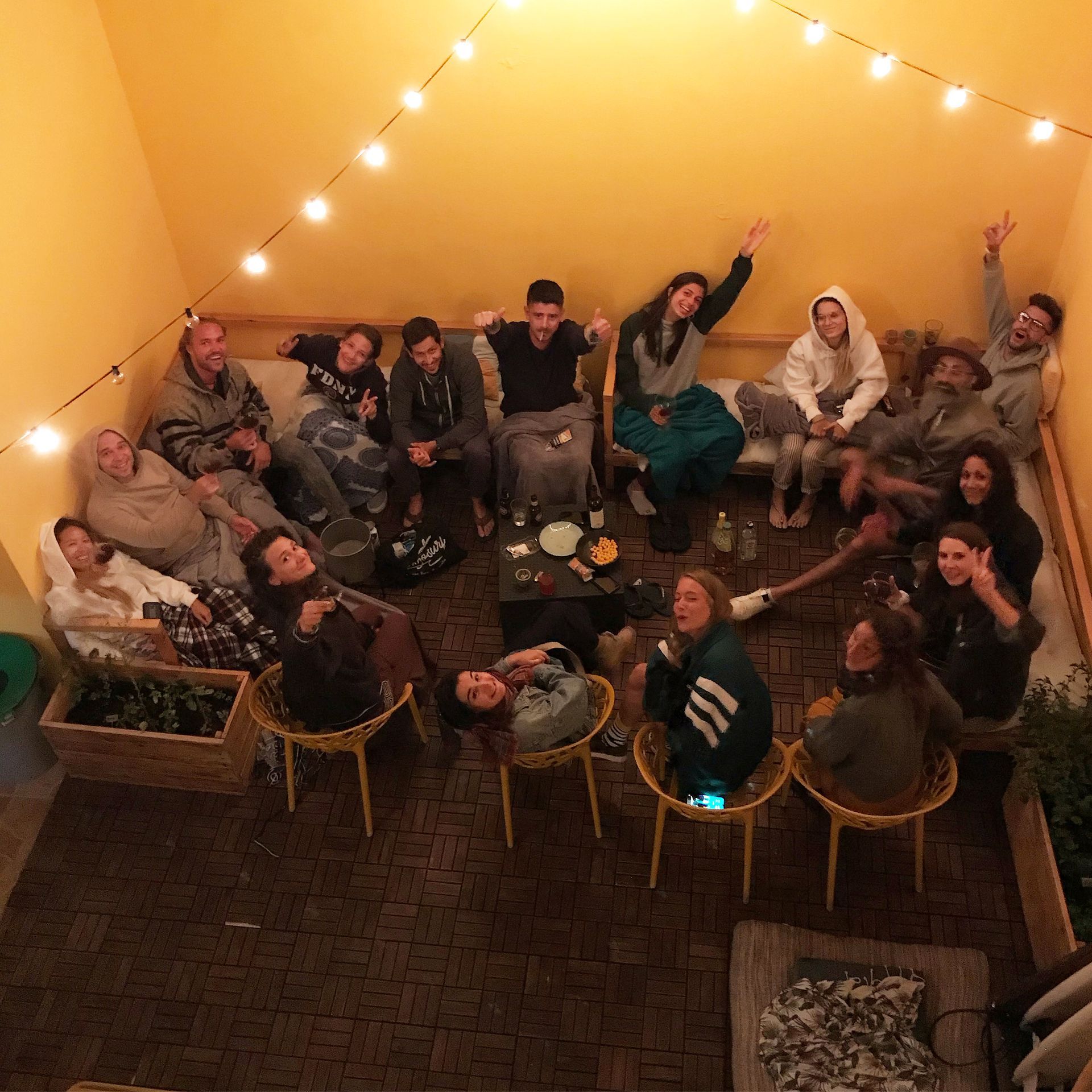 A group of people are posing for a picture in a living room
