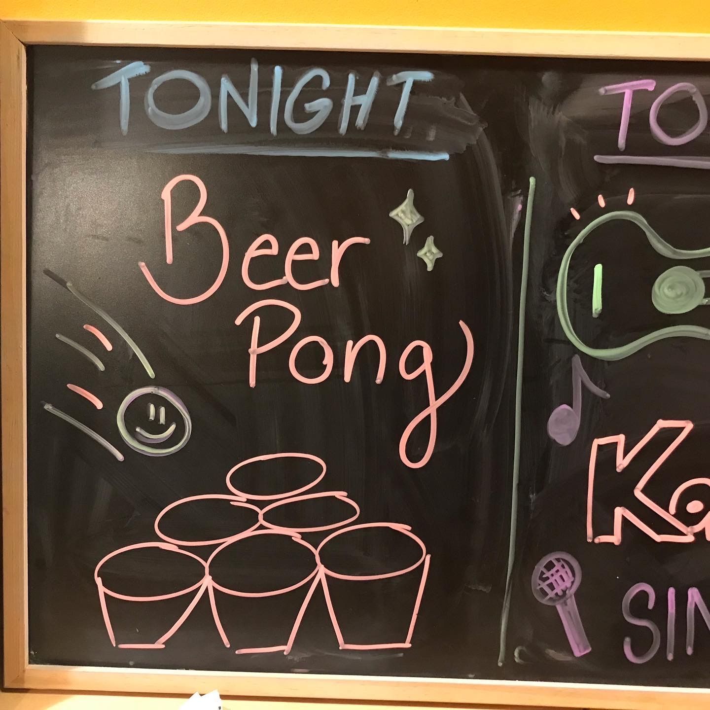 A chalkboard that says tonight beer pong