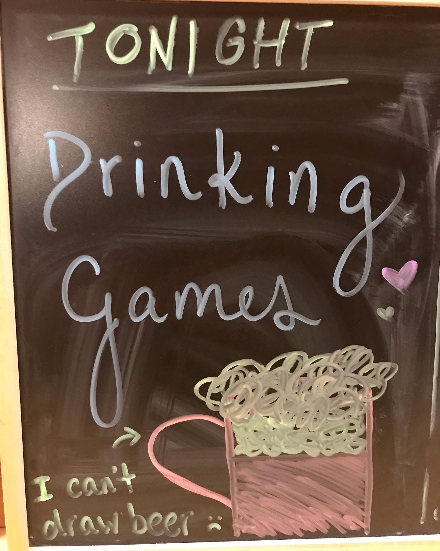 A chalkboard with the words tonight drinking games written on it
