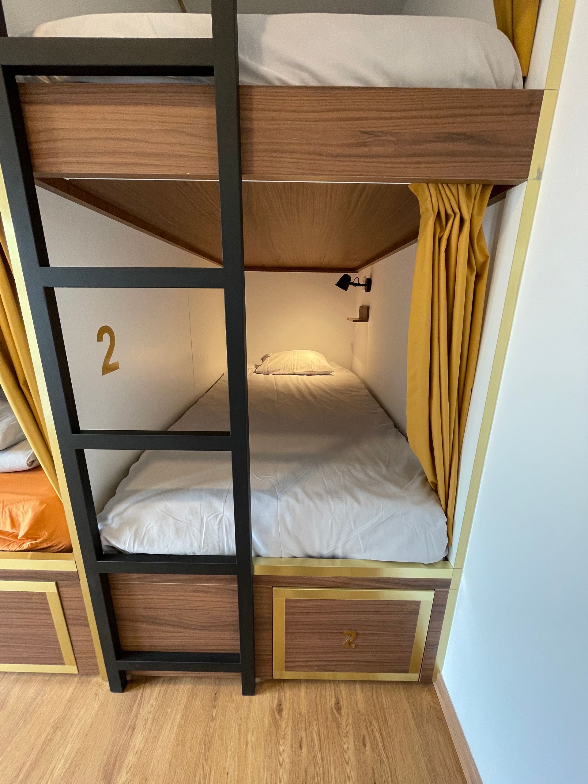 A bunk bed with the number 2 on it