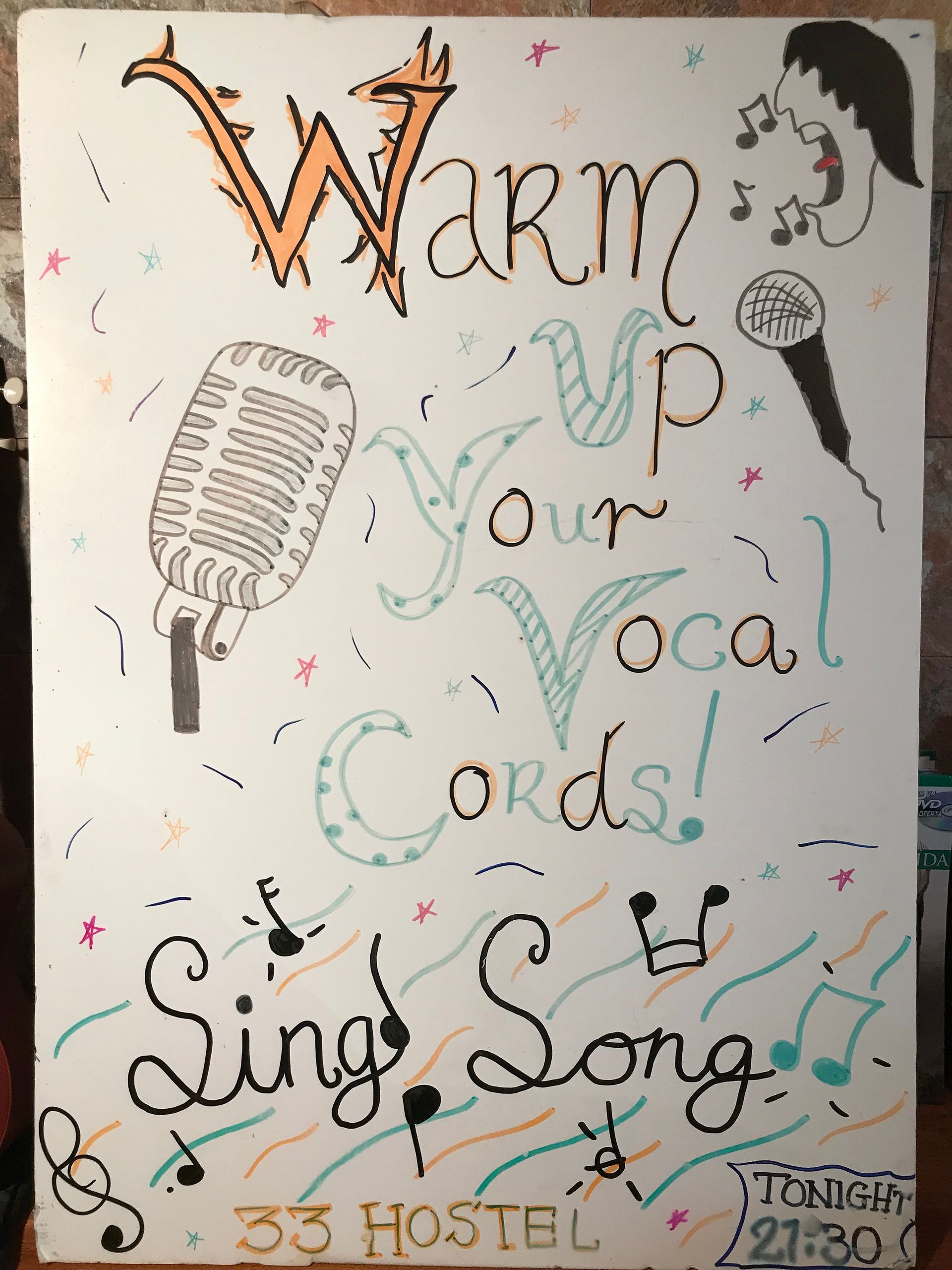 A poster that says warm your vocal cords sing song