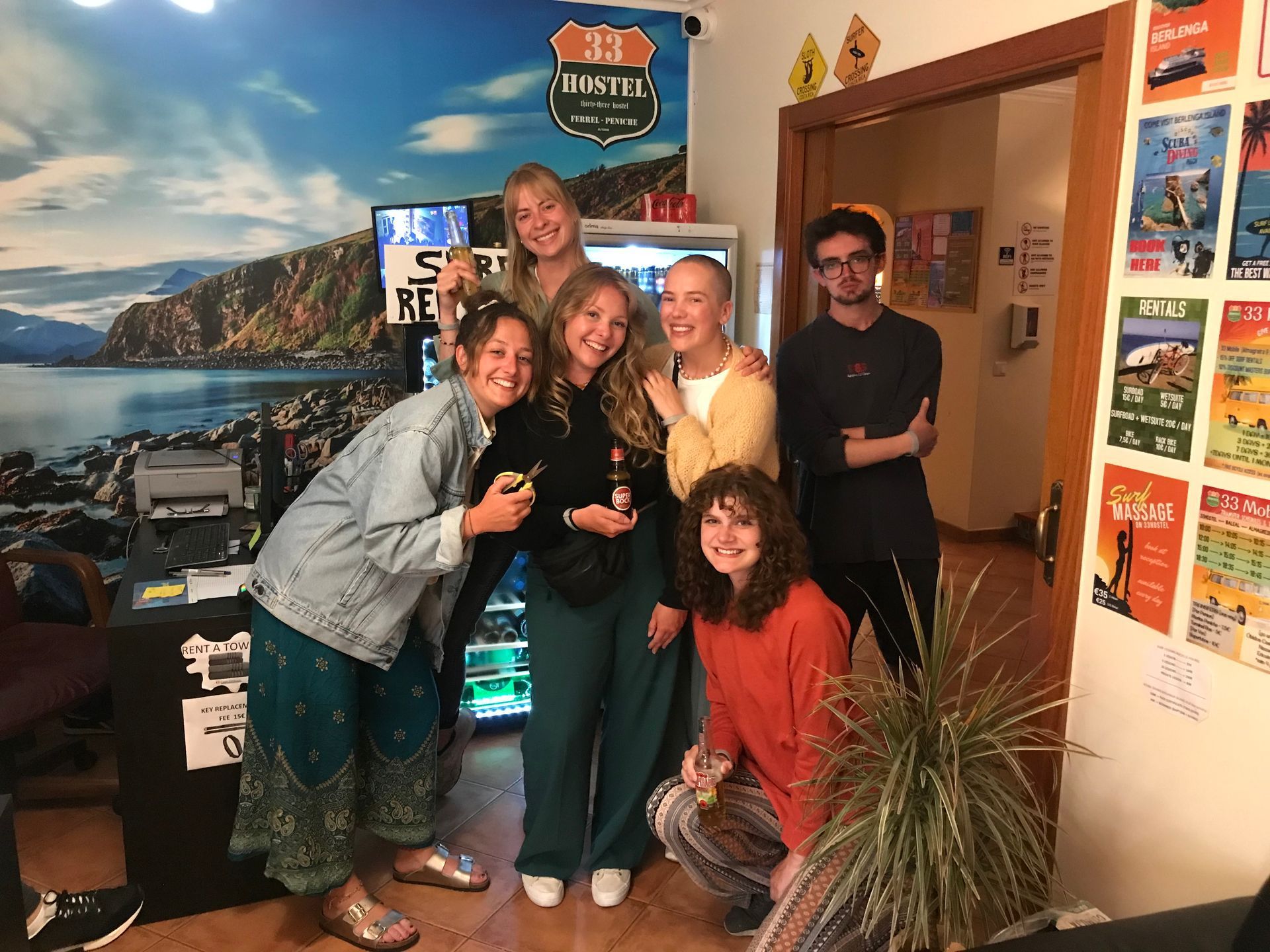 A group of people are posing for a picture in a room.