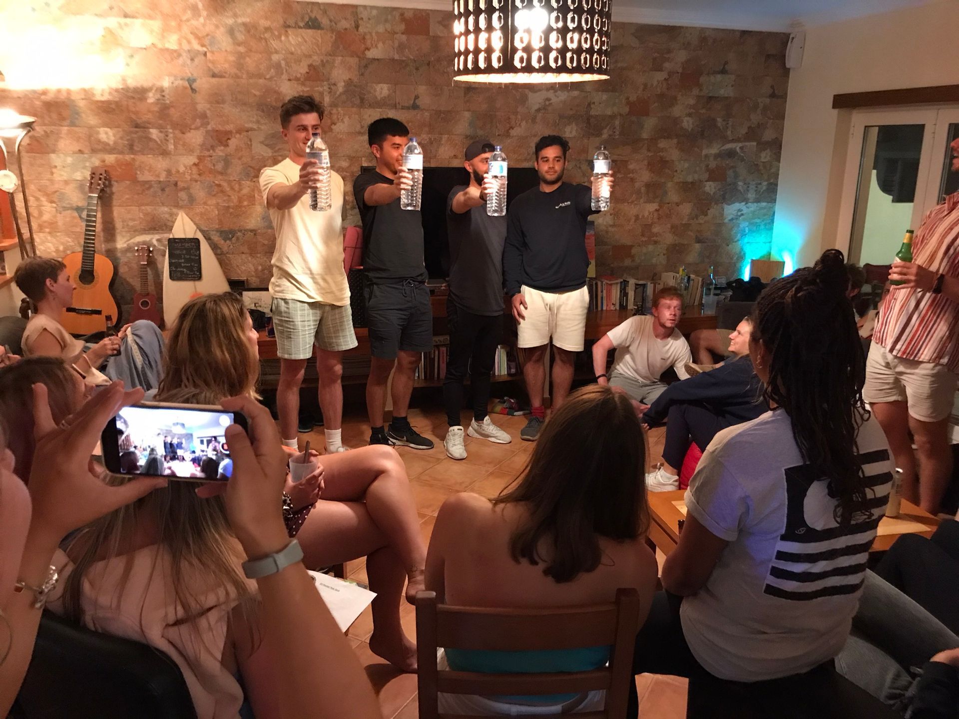 A group of people are gathered in a living room.