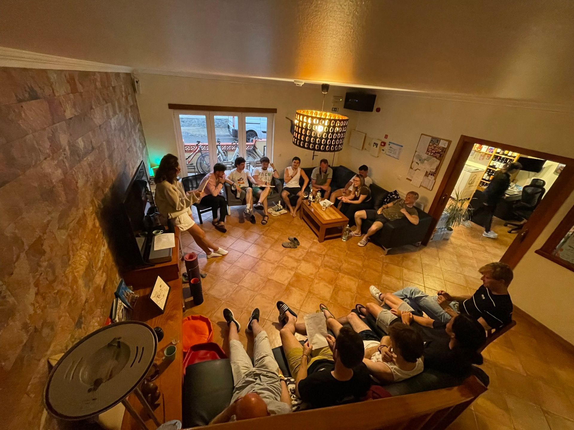 A group of people are sitting in a living room.