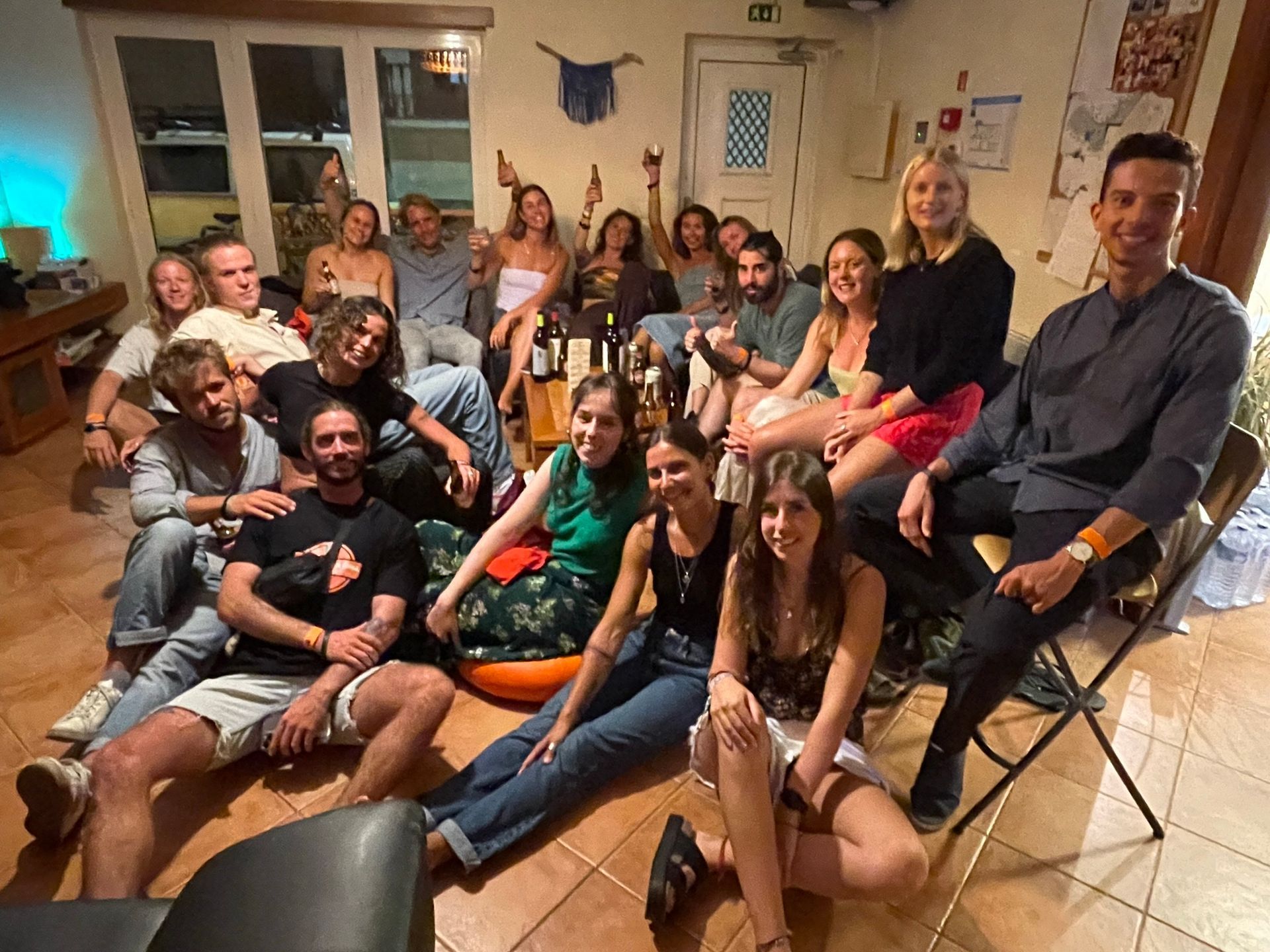A group of people are posing for a picture in a living room.