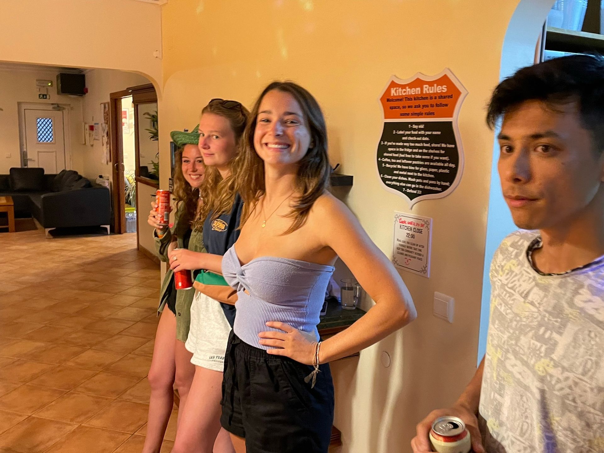 A group of people standing next to each other in a room.