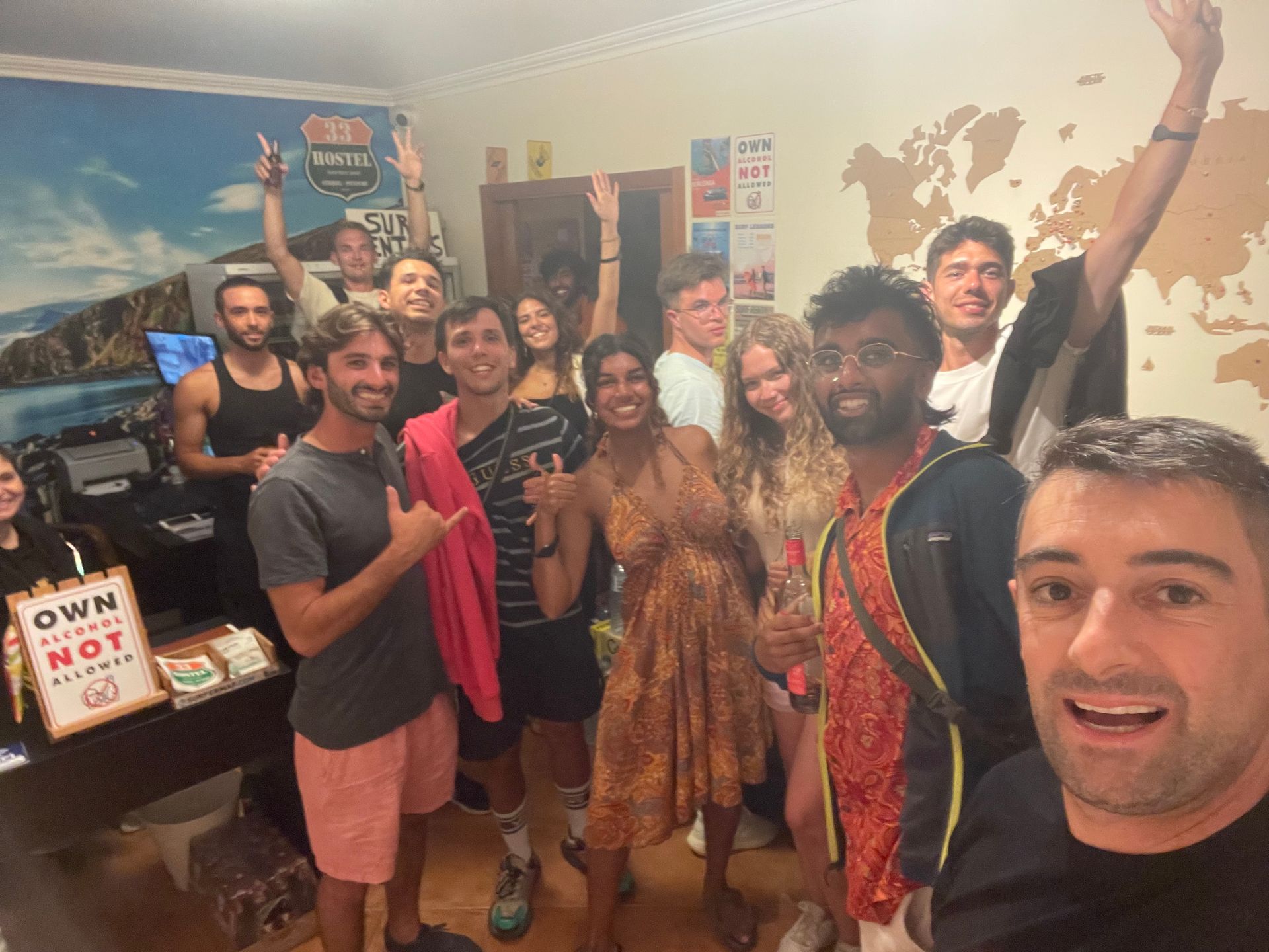 A group of people are posing for a picture in a room.