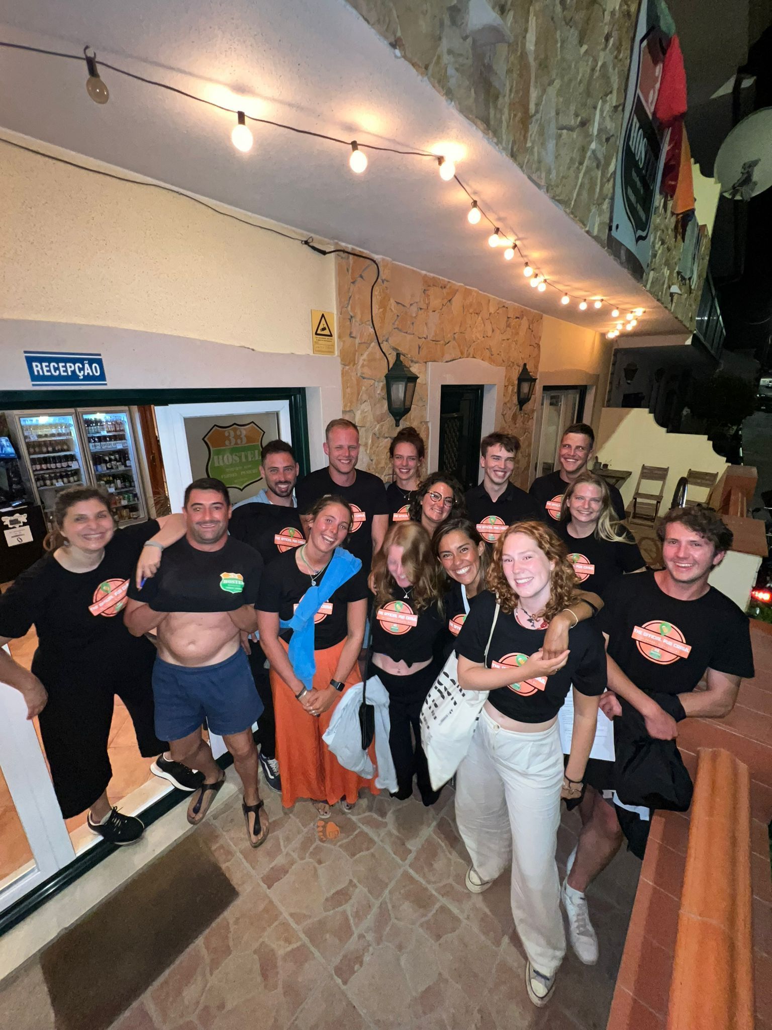 A group of people are posing for a picture in a room.
