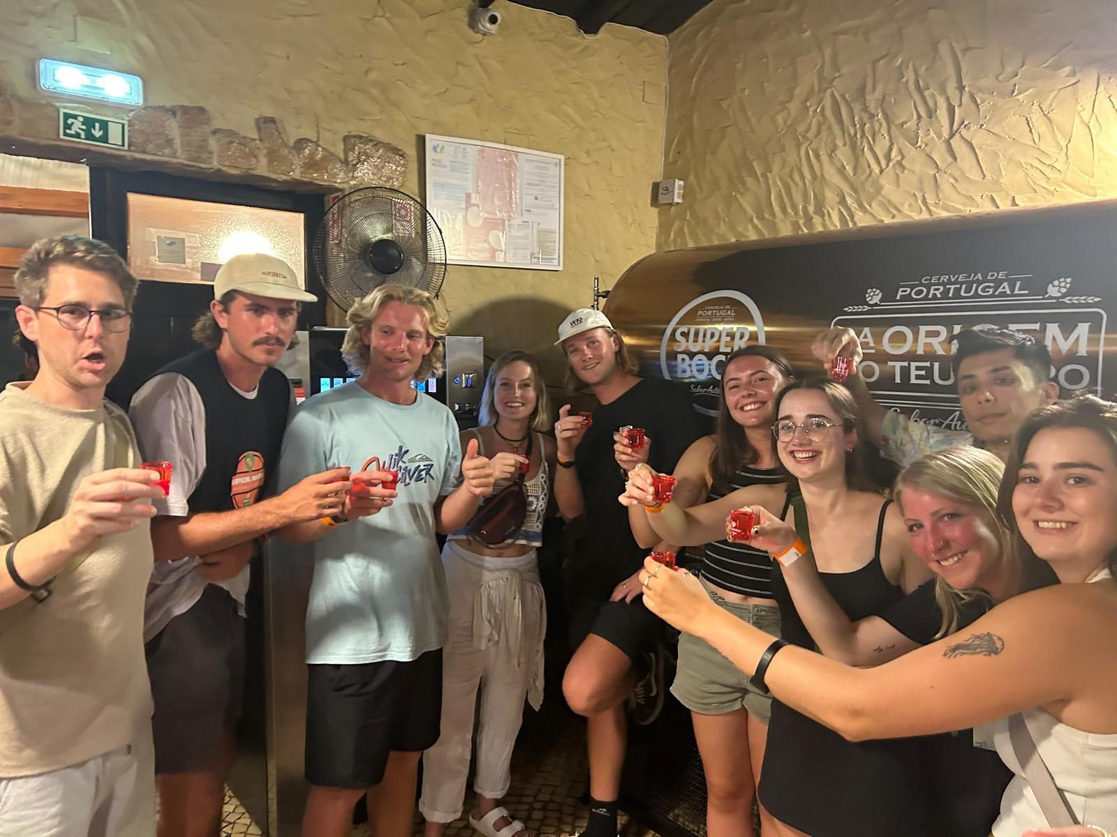 A group of people are standing next to each other in a room.