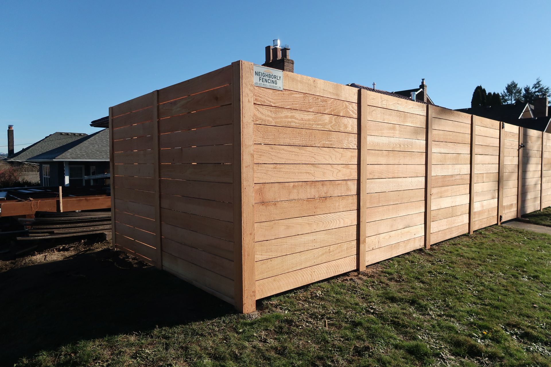 Wooden privacy fence on a sunny day.