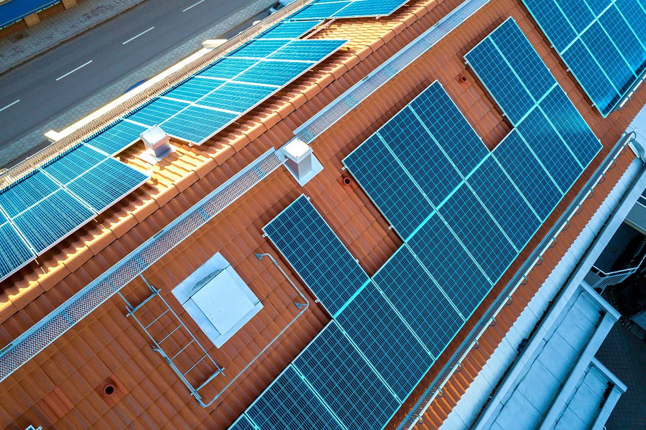 A building with a lot of solar panels on the roof