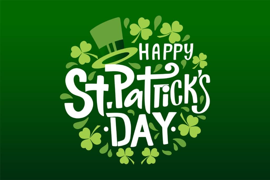 Happy St. Patrick's Day text surrounded by shamrocks and a green hat on a green background.