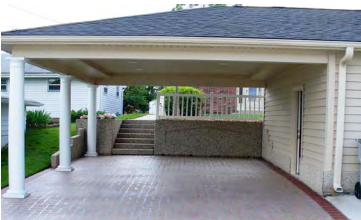 A carport with a staircase leading up to it