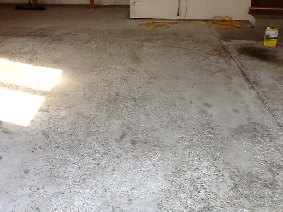 A close up of a concrete floor in a garage.