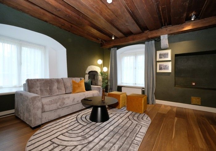 A living room with a couch and a coffee table