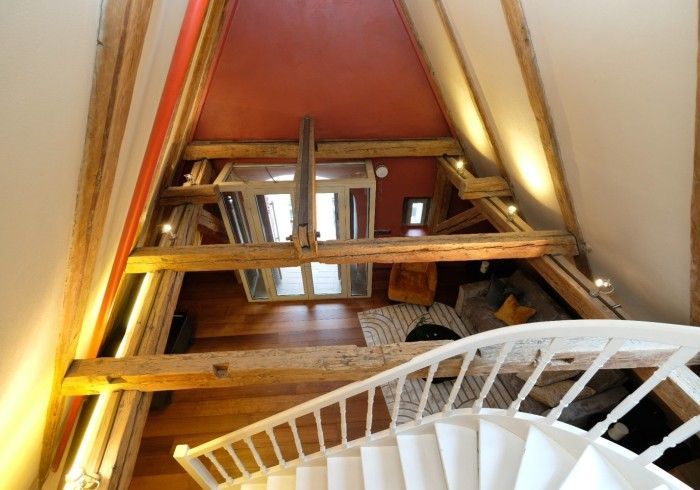 A spiral staircase leading up to the second floor of a house