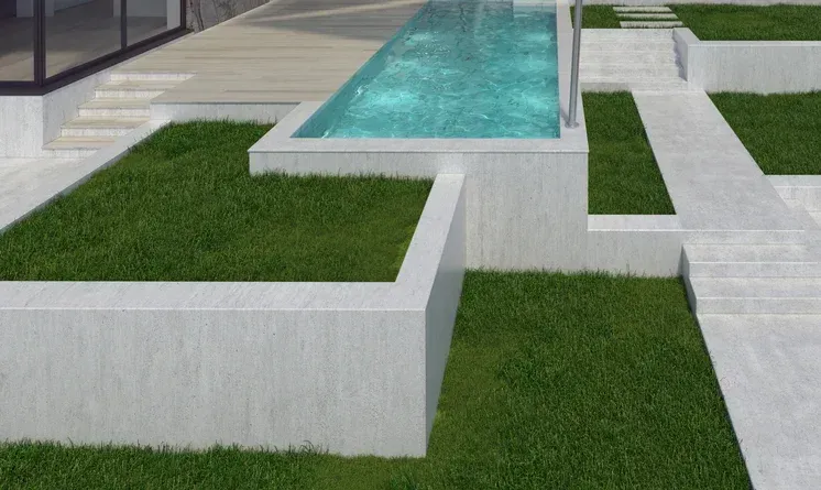 Modern outdoor space with a rectangular pool, green grass, and white concrete structures — Bampak In Coolum Beach QLD