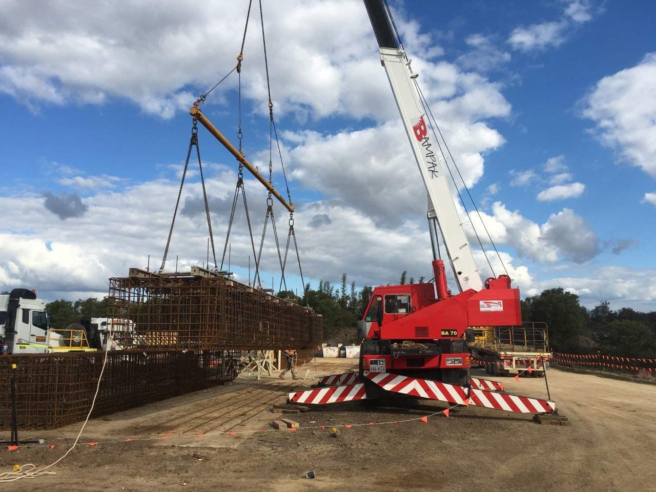 Red Crane Elevating Steel Formwork for Bampak Concreting Services — Bampak In Coolum Beach QLD