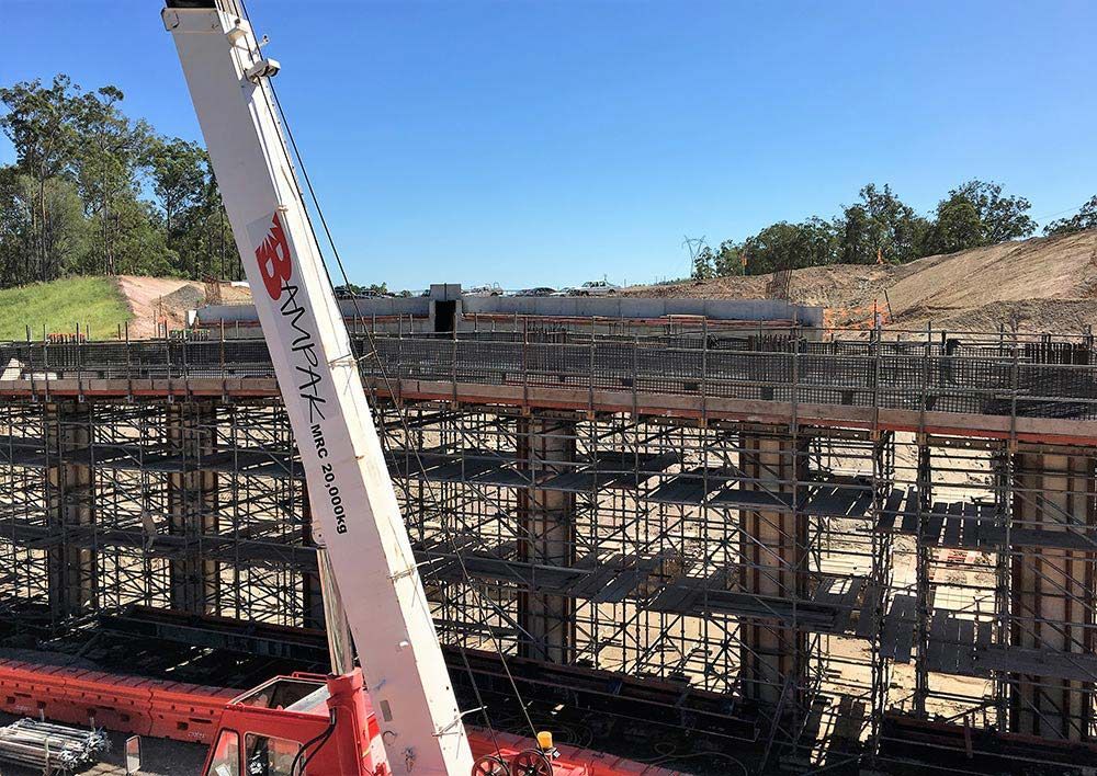 Constructing a Bridge: Crane, Scaffolding, and Steel Bars in Action — Bampak In Coolum Beach QLD
