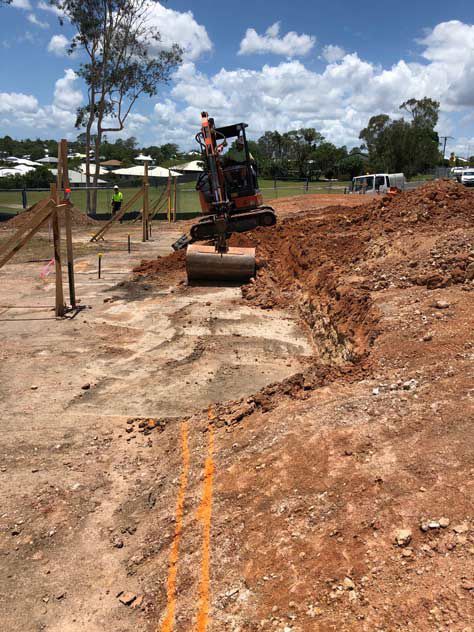 Earthmoving Equipment Efficiently Digs a Trench — Bampak In Coolum Beach QLD
