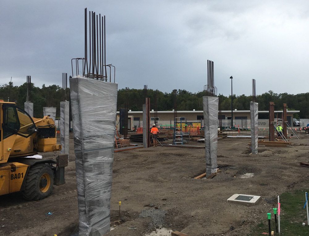 Freshly Poured Concrete Pillars With Plastic Covers — Bampak In Coolum Beach QLD