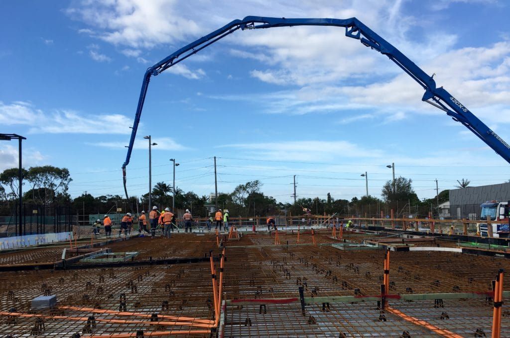 Pouring Concrete on The Tennis Court Construction Slab — Bampak In Coolum Beach QLD