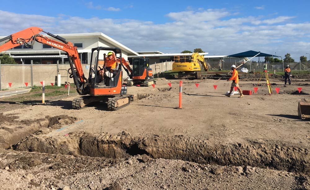 Two Excavators Efficiently Dig a Trench on The Bampak — Bampak In Coolum Beach QLD