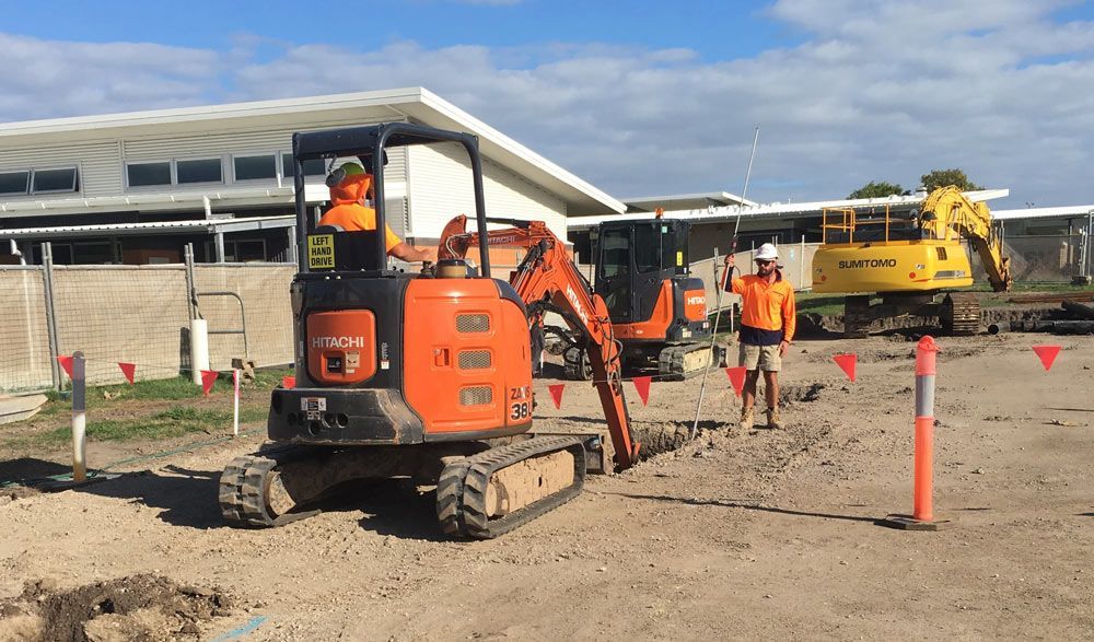 Two Workers Operating Two Excavators Engaged in Digging Activities — Bampak In Coolum Beach QLD