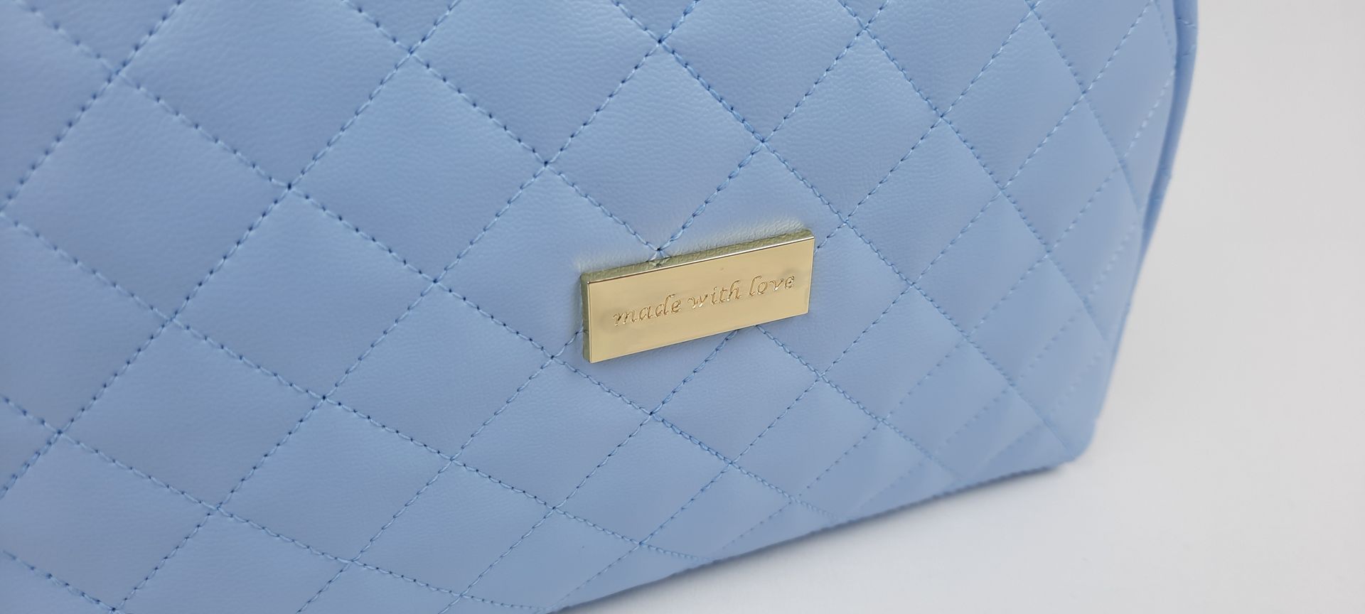 NECESSAIRE REDONDO PELE SINTÉTICA ACOLCHOADA COR AZUL ACESSÓRIOS DOURADOS