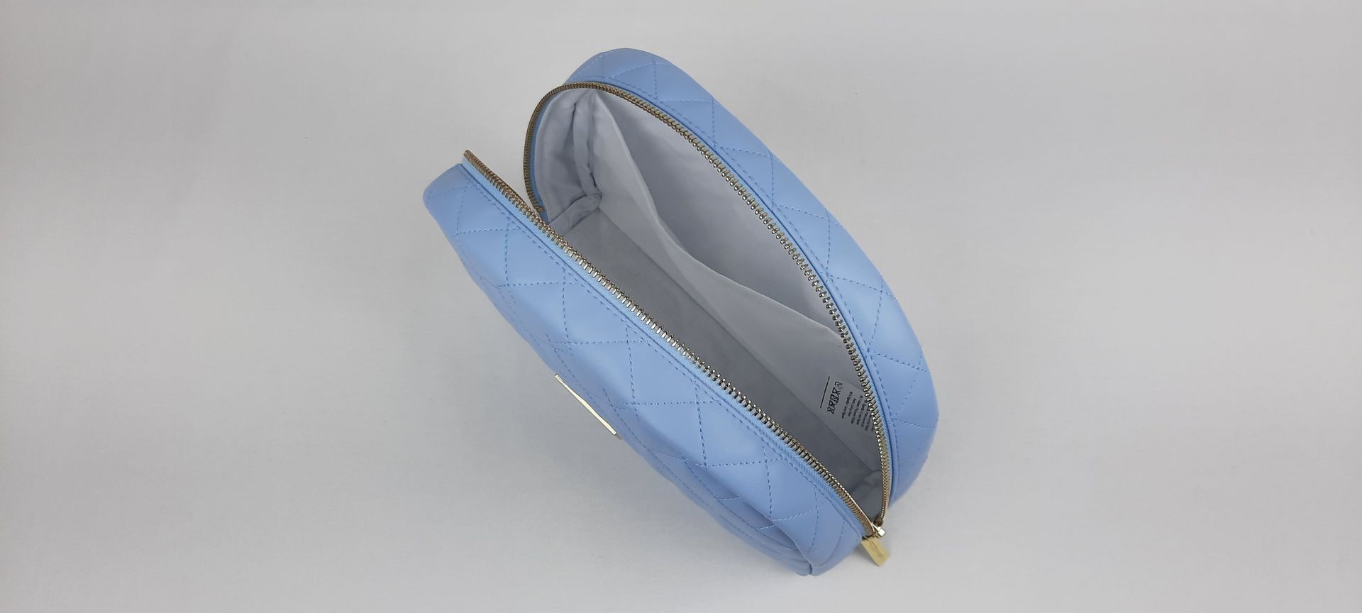 NECESSAIRE REDONDO PELE SINTÉTICA ACOLCHOADA COR AZUL ACESSÓRIOS DOURADOS