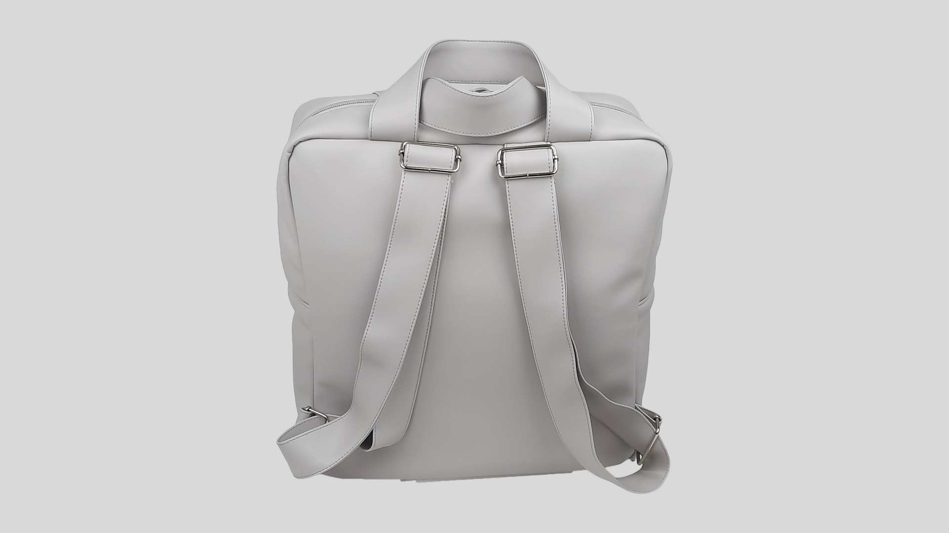 MOCHILA PELE SINTÉTICA LISA COR CINZA COM BOLSO EXTERIOR, FECHO DE CORRER, ALÇAS TRASEIRAS AJUSTÁVEIS E LAÇO