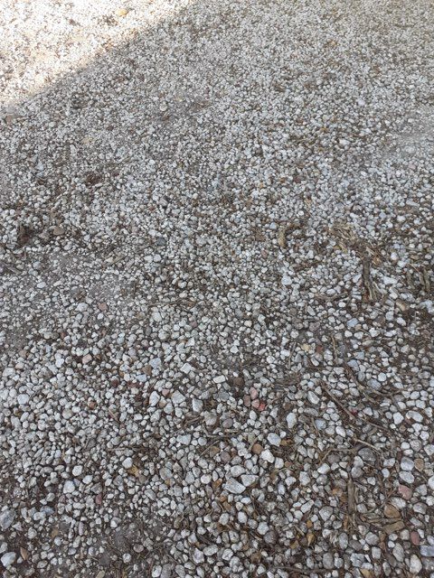 A close up of a pile of gravel on the ground.