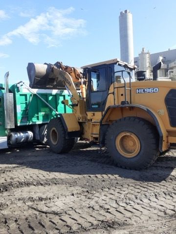 A yellow tractor with the letters hi380 on it