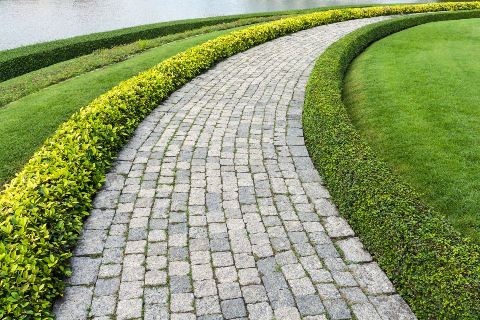 Brick Walks — the Stone Block Walk Path With Green Grass in Morris Plains, NJ