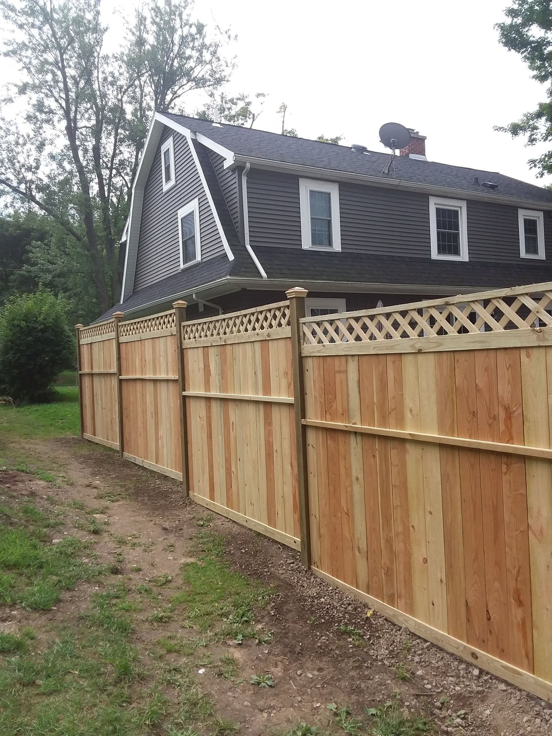 Wood fence installation in Delavan, NY by KKR Fencing