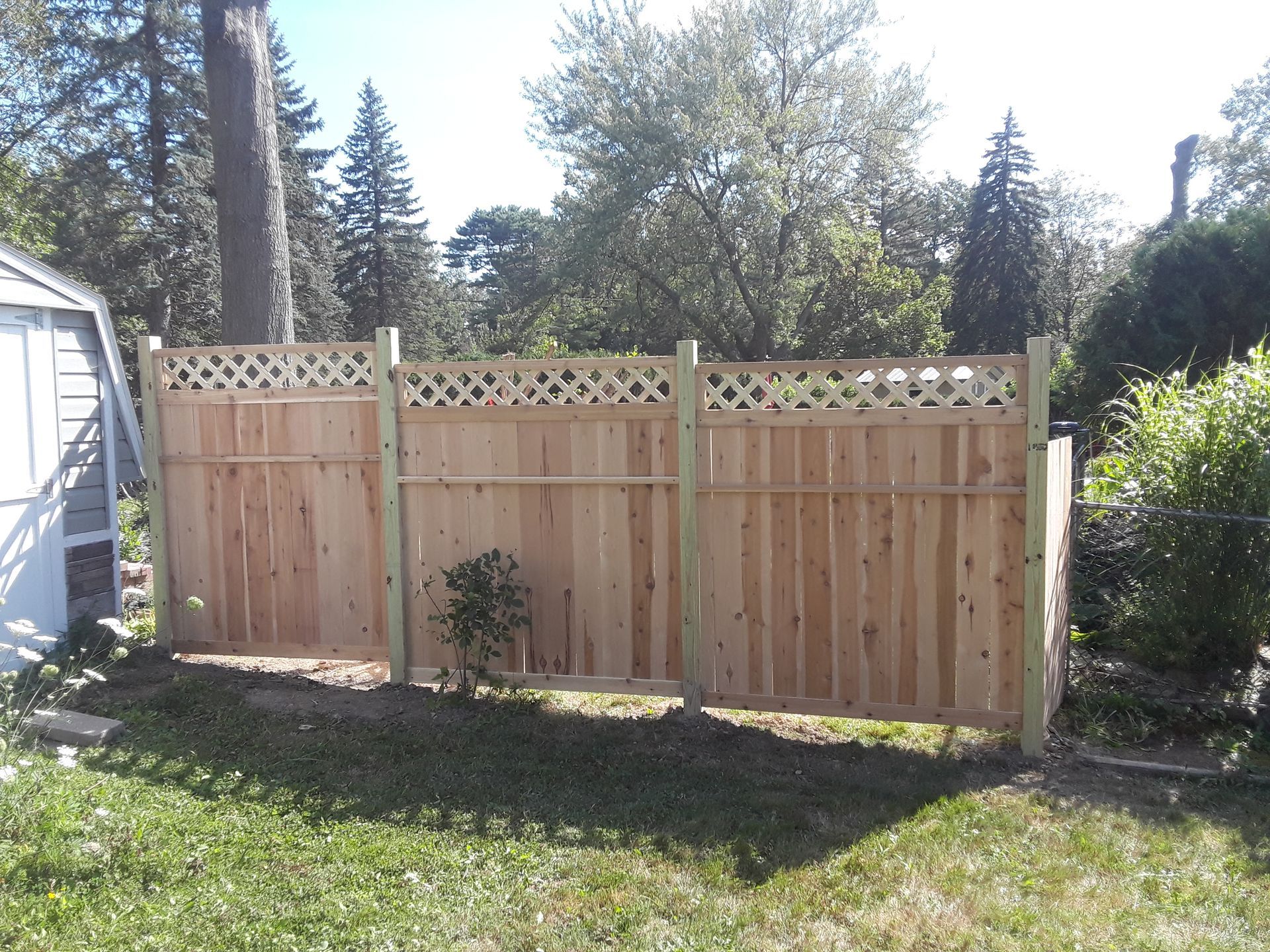 Wood fence installation in Delavan, NY by KKR Fencing