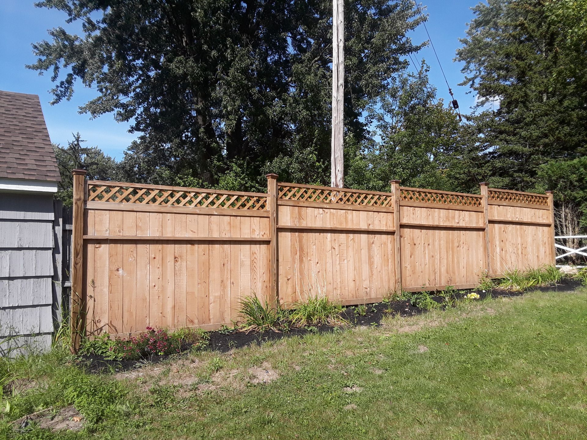 Wood fence installation in Delavan, NY by KKR Fencing