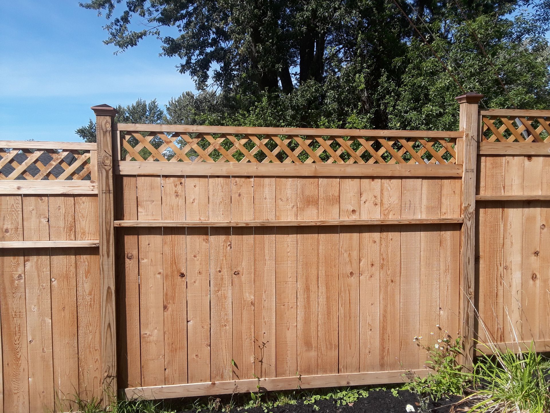 Wood fence installation in Delavan, NY by KKR Fencing