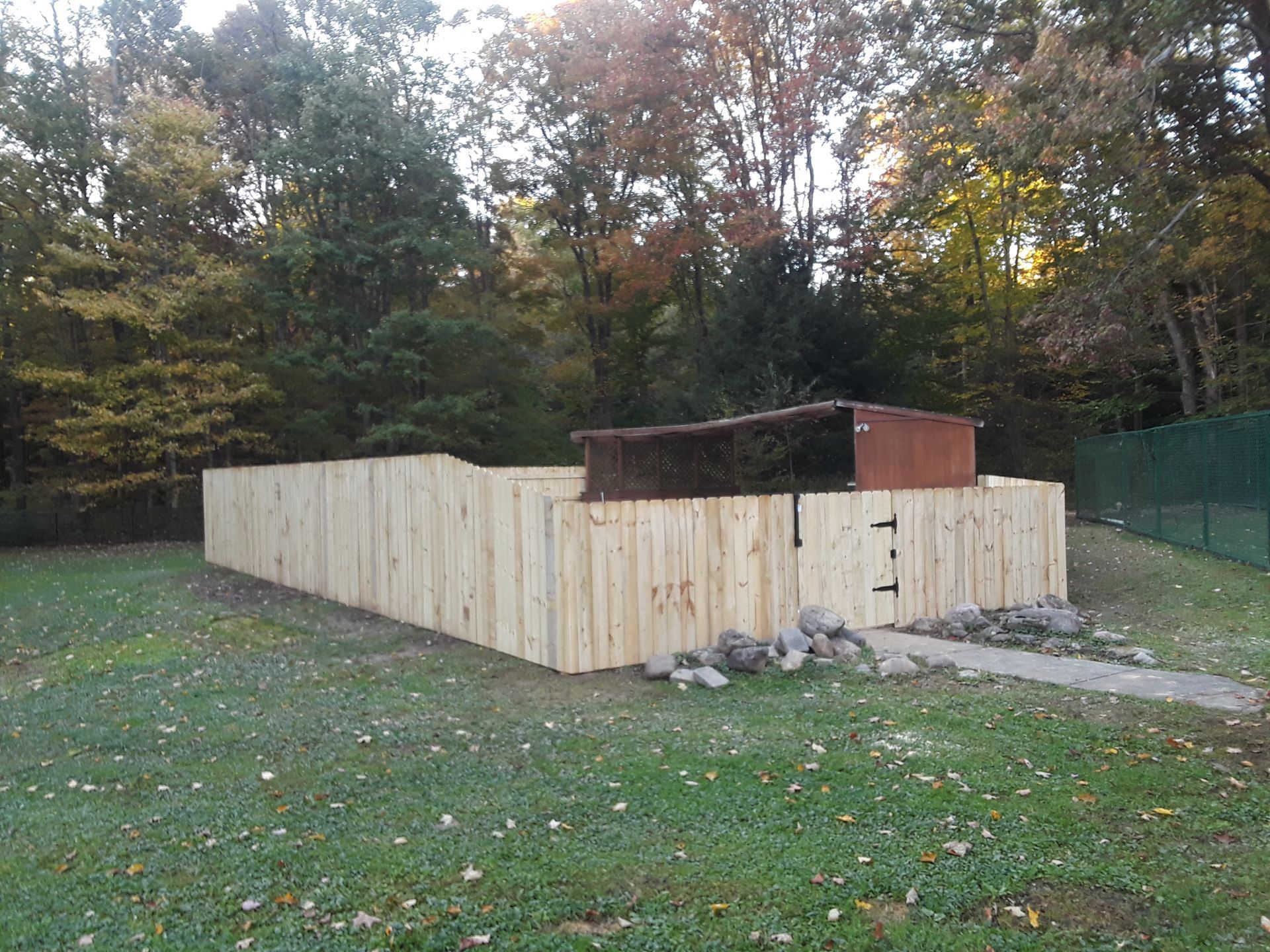 Wood fence installation  in Delavan, NY by KKR Fencing